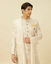 alt message - Manyavar Men Cream Pink Bel Buti Patterned Sherwani Set image number 0